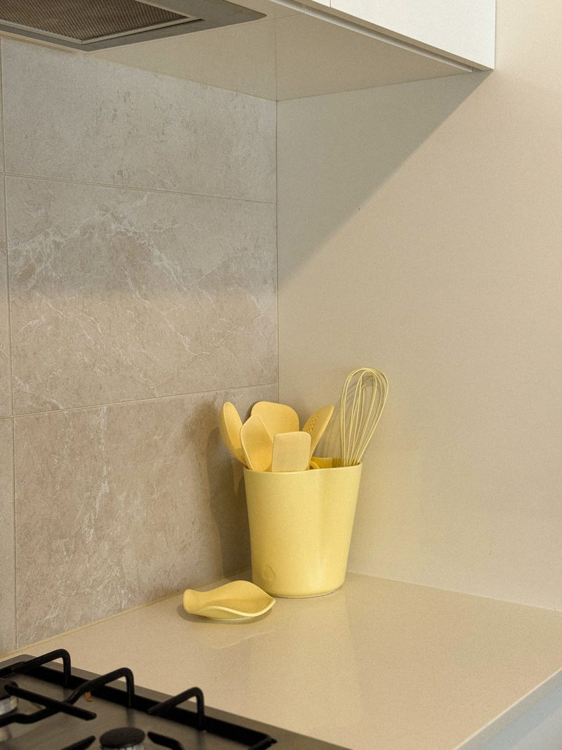 The Butter Bunch Holder and Spoon Rest in a kitchen corner